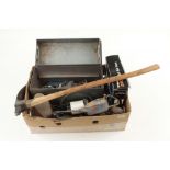 A tin case of spanners and other tools