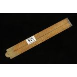 An unusual 2' two fold boxwood and brass slide rule by WHITTAM & Co Makers Salford with scales for