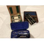 Two sets of drawing instruments and a protractor in orig cases
