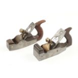 Two handled iron smoothers with brass lever G