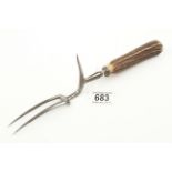 An unusual fork with integral guard and antler handle G+