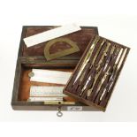 A 12 piece brass drawing set with four ivory rules in lockable rosewood box G