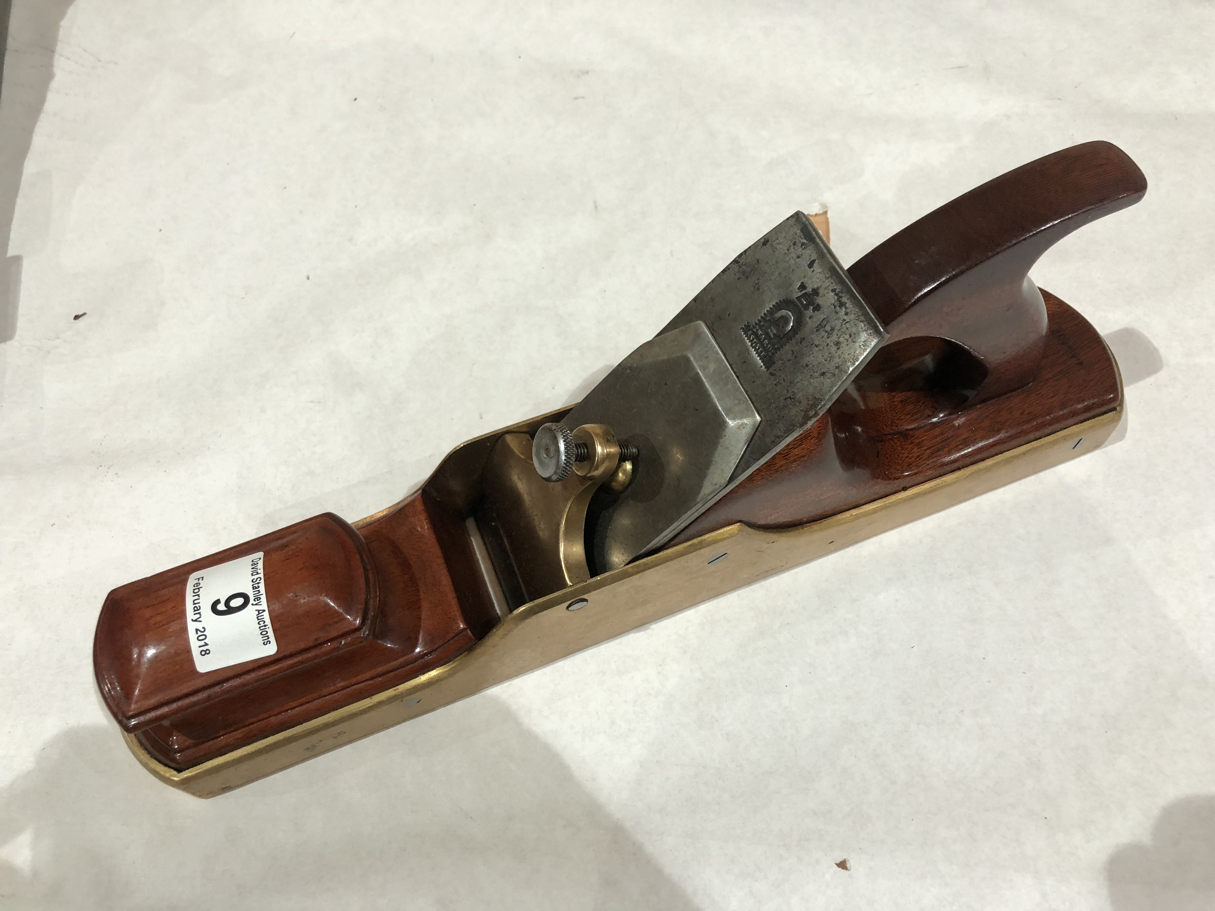 A brass panel plane with mahogany infill G