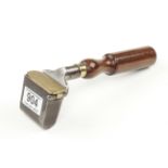 A fine quality bookbinders leather iron with rosewood handle and brass lid F