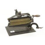 An unusual patent crimping machine with bench clamp and brass rollers by CROWN G