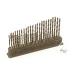 A set of 60 drill bits in iron stand by The CLEVELAND TWIST DRILL Co not all original G+