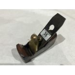 A small iron smoother with brass lever G+