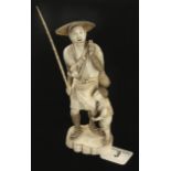 An ivory okimono of a fisherman and his