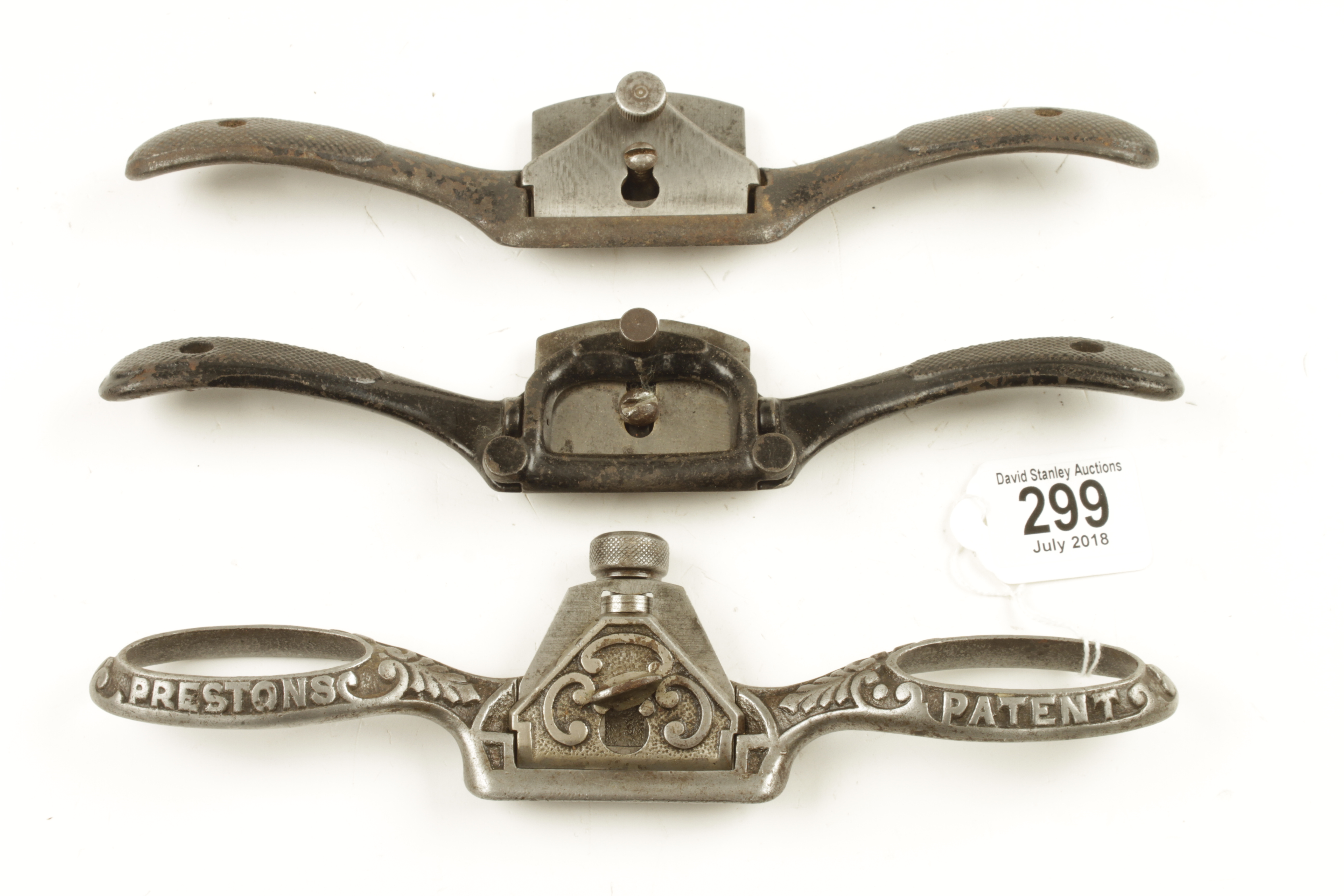 A decorative iron spokeshave by PRESTON and two other shaves by STANLEY G+