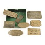 A collection of eight mainly brass name or company plaques, Hogarth, Robley, Worssam,
