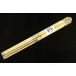 An ironmongers Presentation 24" four fold ivory rule with brass slide and fittings inscribed