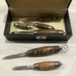 A collection of six barrel knives,