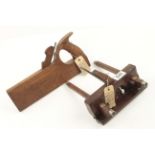 A small rosewood plough of European design and a handled tonguing plane by E SMITH G++