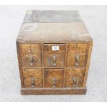 A small chest of six oak drawers 17"x 22"x 17" the drawers going the full length of the chest the