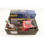 A CHAMPION router and a POWERCRAFT router table both in orig boxes.