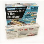 Two tile cutters in original boxes G+