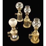 Four brass lamps with glass bowls G