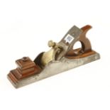 A fine quality 14 1/2" Scottish iron panel plane with mahogany infill and handle a fancy brass