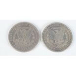 U.S.A. silver dollars 1884 and 1886.