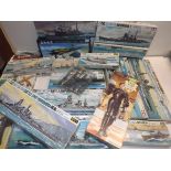 A collection of plastic model kits, mainly shipping.