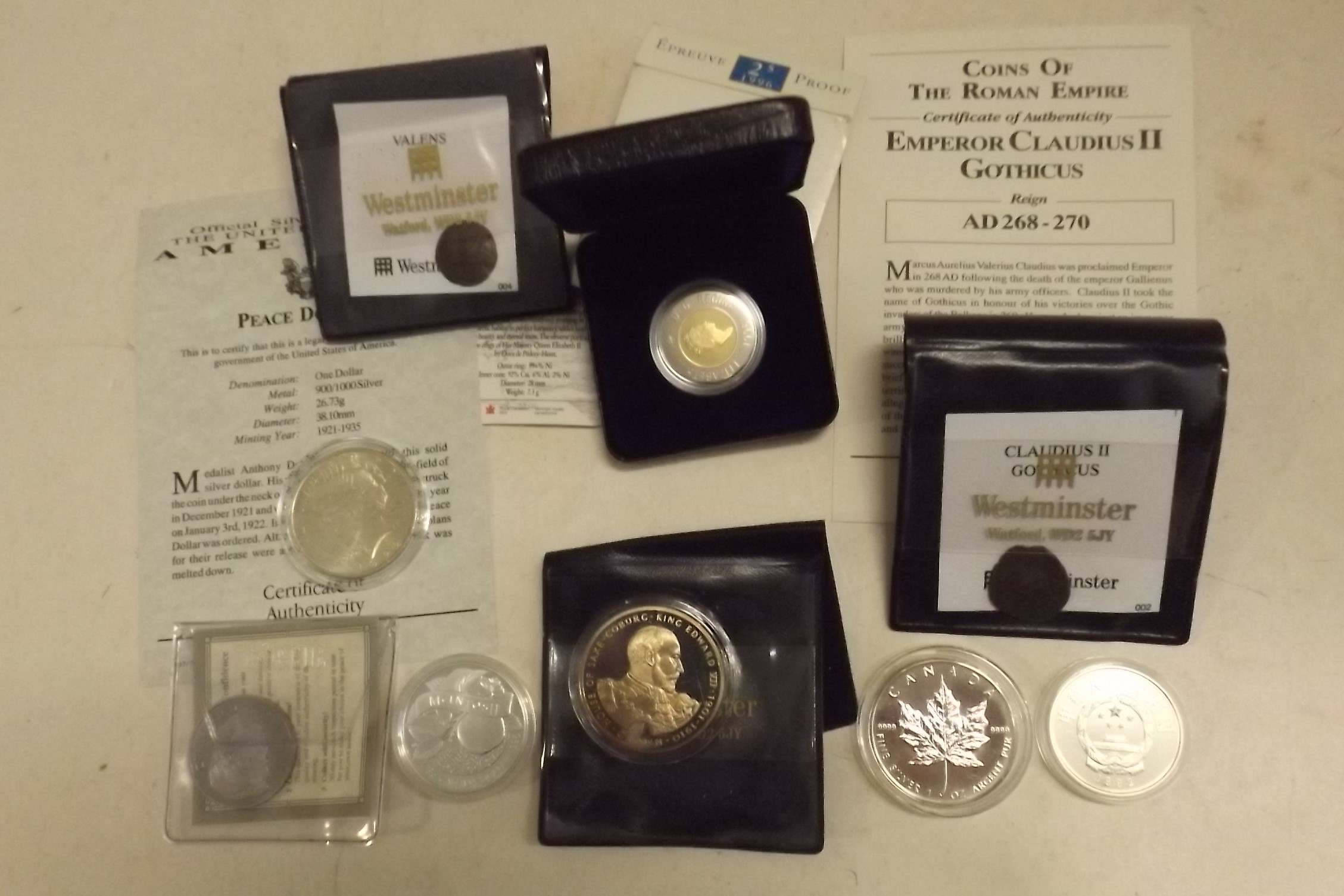 USA 1922 Peace dollar, Canada 1996 dollar, two Roman coins etc, some with certificates.