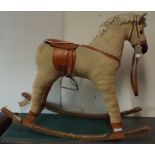 A wood framed, corduroy covered rocking horse full height 28".