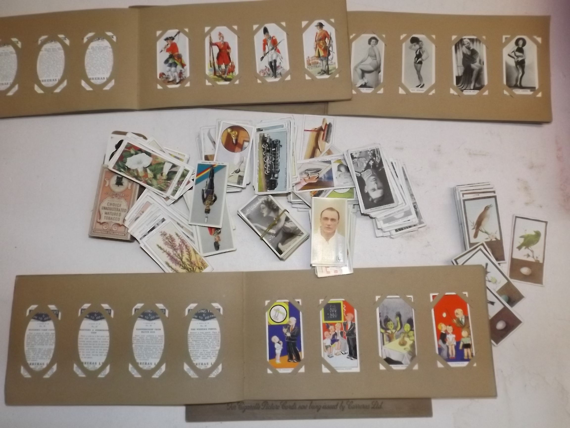 Cigarette cards in albums and loose.