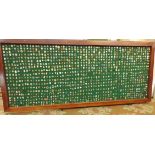 A large framed board (98x41 inches) containing approximately 1800 bowling badges,