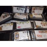 A collection of first day covers in nine albums.