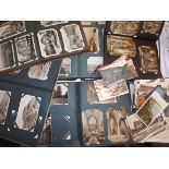 Approximately 500+ postcards contained in five albums and loose, much foreign.