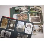 A collection of postcards in two albums and loose including topo's (Wales etc) Louis Wain (1) silks