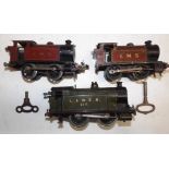 Two 0 gauge clockwork Hornby 0-4-0 reversing locomotives, together with a larger L and N.E.R.