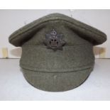 A British cloth cap with early Devonshire Regiment badge, excellent order.