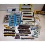 A collection of 'N' gauge railway items including wagons and carriages, some boxed,