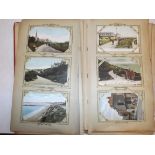 An Edwardian album containing approximately 220 postcards, many Cornish but damp affected.