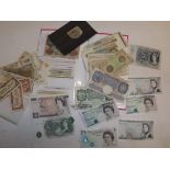 A quantity of World Bank notes in flip album and loose including British £10, £5 and wartime £1.