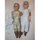Two kid bodied shoulder plate porcelain headed dolls, one with moulded hair, length of each 13".