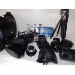 Olympus OM10 camera with electronic T20 flash, one 28mm lens, one teleconverter, one 135 mm lens,