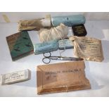 WWII period First Aid booklets, dressings and needle bit.