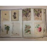 A linen leaved scrap album full of greetings cards etc.