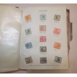 A Paragon postage stamp catalogue. well filled with early to mid period stamps, damp affected.