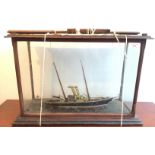 A painted wooden model of a ship, late 19th century, in a mahogany glazed case, height 49cm,