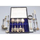 A silver bright cut sugar sifting spoon, a set of five Exeter silver fiddle pattern teaspoons,