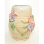 A Clarice Cliff vase, of bulbous form and decorated with floral sprays on a branch, height 21cm.