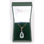 An impressive aquamarine and diamond pendant, the principal stone,