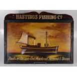 A painted wooden sign inscribed 'Hastings Fishing Co, Fruits of the sea - Cod, Mackerel,