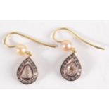 A pair of gold, pearl and rose cut diamond earrings.