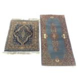 Two Indian rugs, the larger with a sky blue field and floral lobed medallion, 136 x 67.