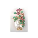A post war gold brooch in the form of a vase of flowers with a blister pearl and coloured stones.
