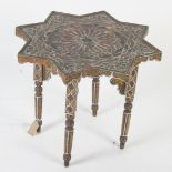 An Islamic style painted wood occasional table, with turned tapering supports, height 51.